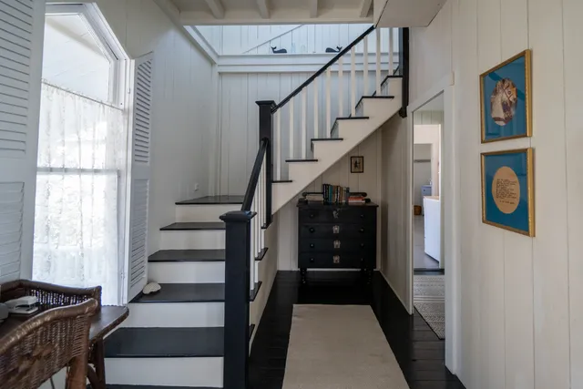 a view of entryway with stairs and wooden floor