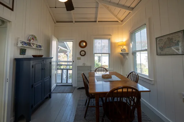 a view of a dining room with furniture and window