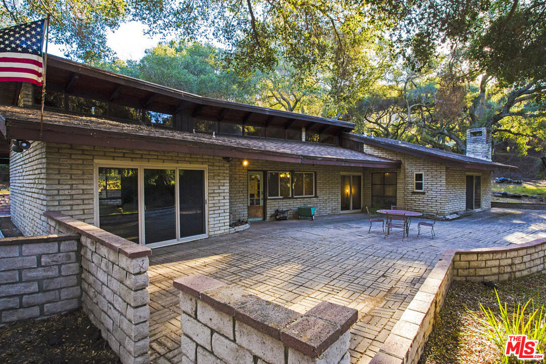 465 Cold Canyon Road Calabasas, CA 91302 - Photo 3 of 9 a view of a house with a patio