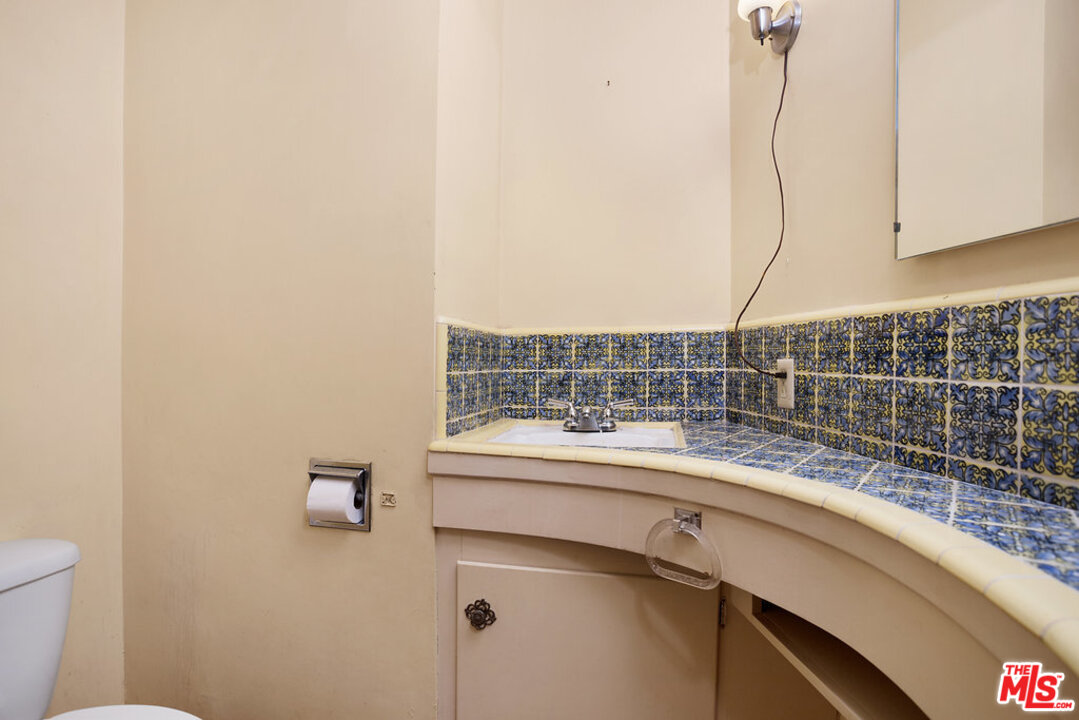 465 Cold Canyon Road Calabasas, CA 91302 - Photo 7 of 9 a kitchen with a sink and a stove