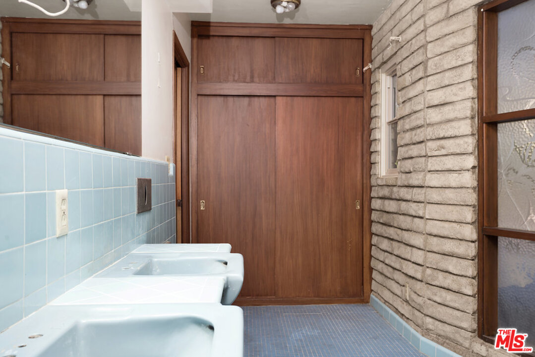 465 Cold Canyon Road Calabasas, CA 91302 - Photo 8 of 9 a bathroom with a sink a toilet and shower
