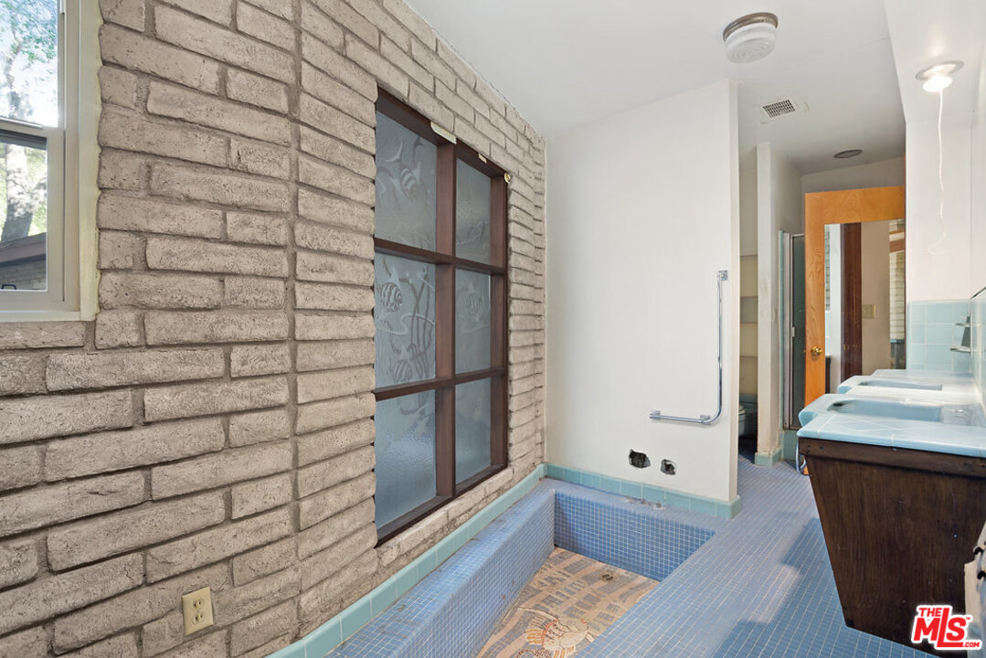 465 Cold Canyon Road Calabasas, CA 91302 - Photo 9 of 9 a bathroom with a bathtub and shower