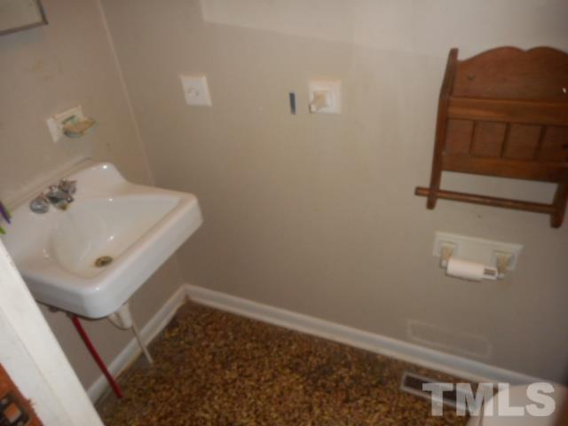 10401 Ten-Ten Road Raleigh, NC 27603 - Photo 13 of 18 a bathroom with a sink and a mirror