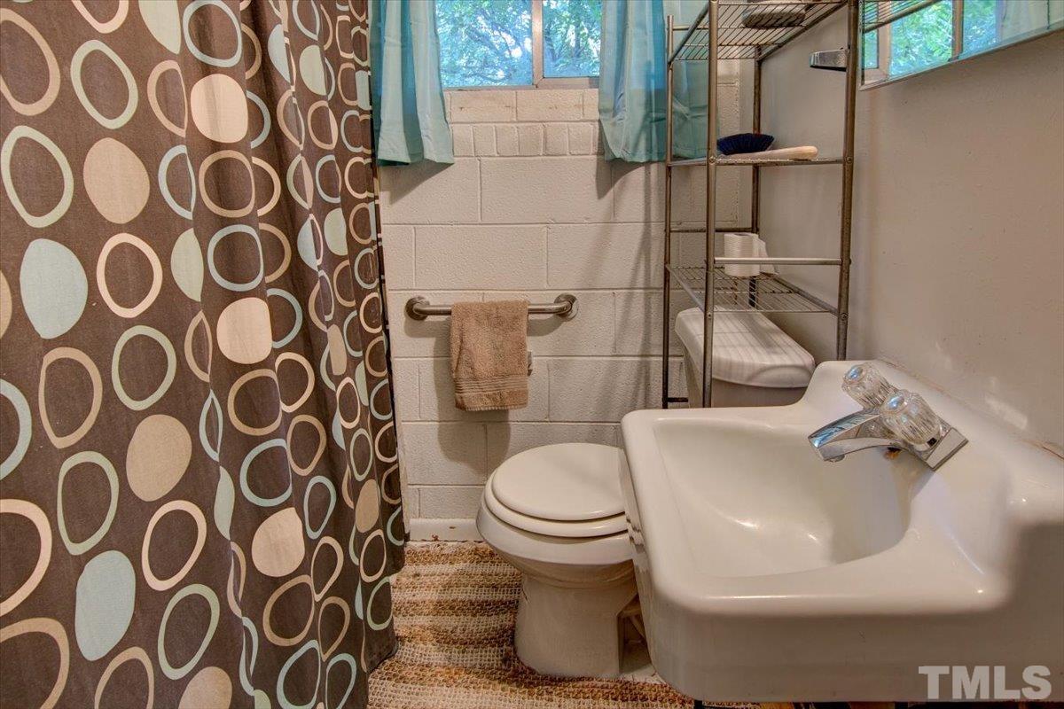 10401 Ten-Ten Road Raleigh, NC 27603 - Photo 15 of 18 a bathroom with a sink and a toilet