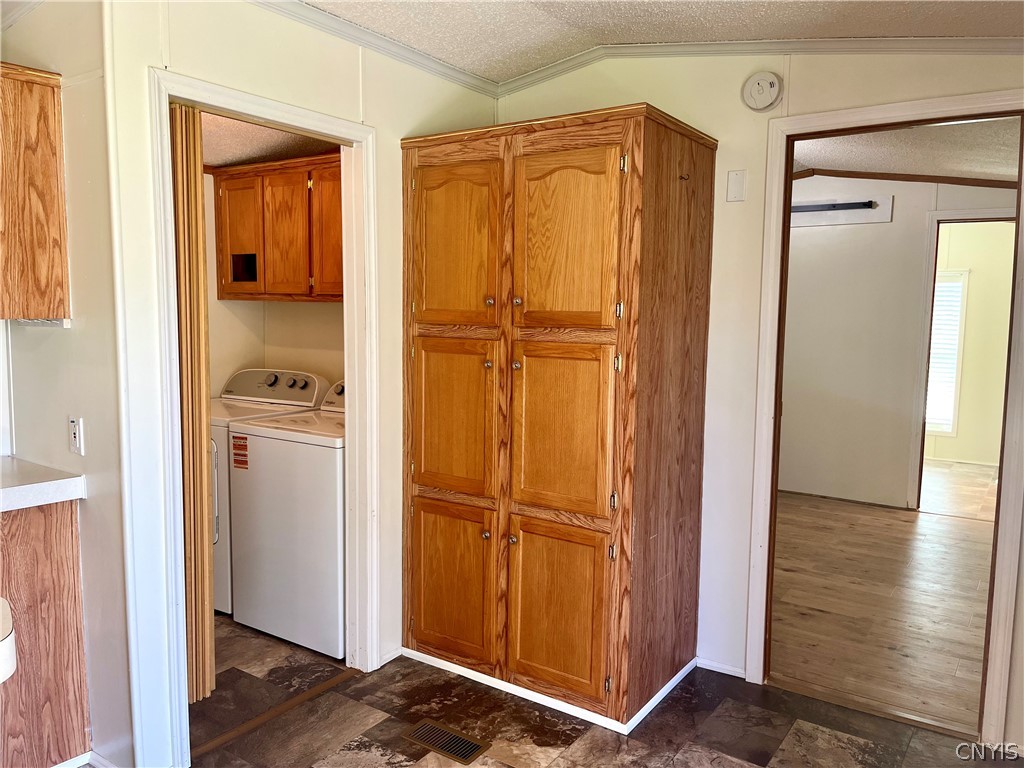 47 Miner Road Scriba, NY 13126 - Photo 10 of 23 Laundry room and pantry cabinets