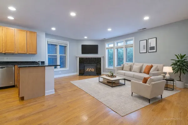 a living room with furniture and a fireplace