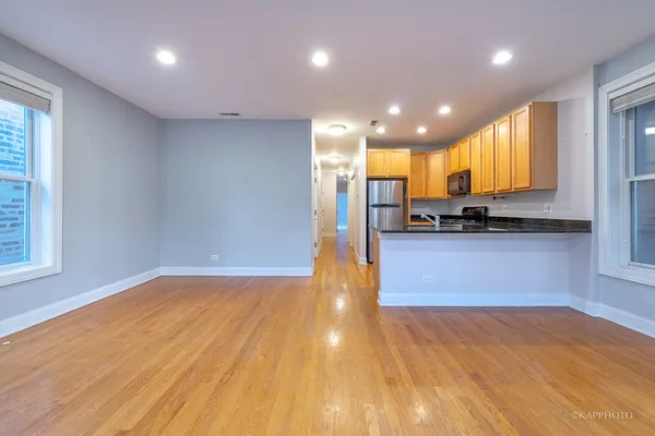 a view of a kitchen with a sink and cabinets