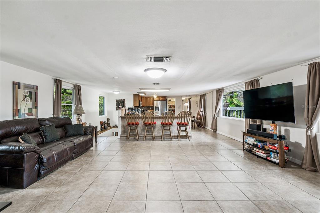 37440 Phelps Road Zephyrhills, FL 33541 - Photo 18 of 80 a living room with furniture and a flat screen tv
