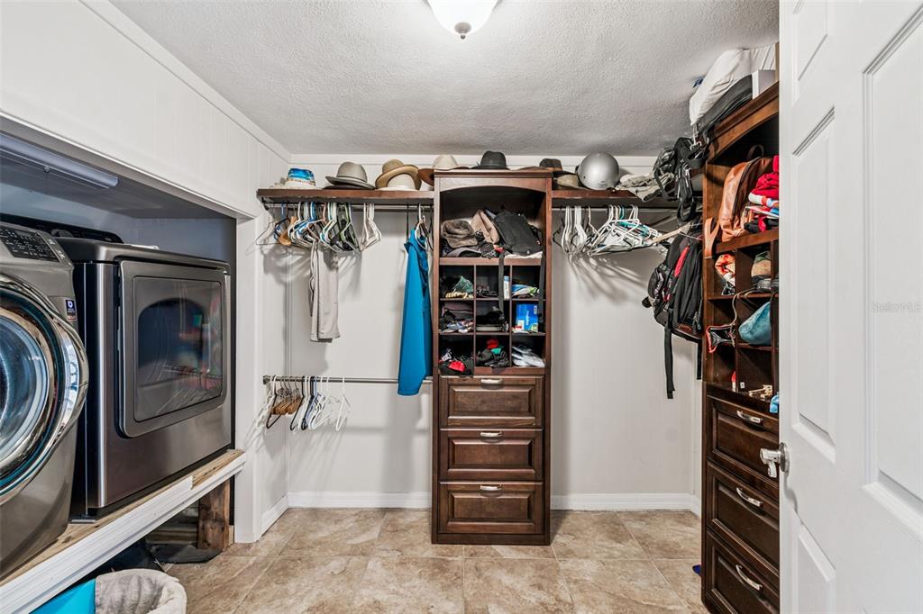 37440 Phelps Road Zephyrhills, FL 33541 - Photo 27 of 80 a view of walk in closet with clothes and shoes