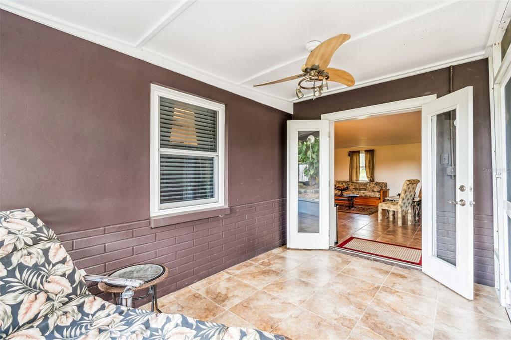 37440 Phelps Road Zephyrhills, FL 33541 - Photo 55 of 80 a very nice looking room with a large window and a chandelier