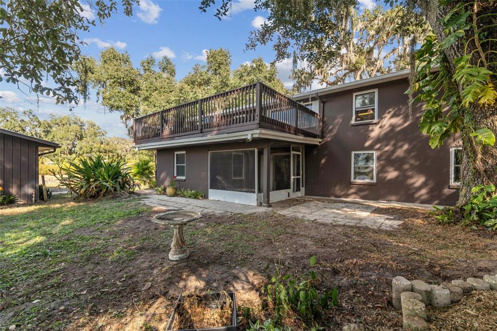 37440 Phelps Road Zephyrhills, FL 33541 - Photo 70 of 80 a front view of a house with a garden