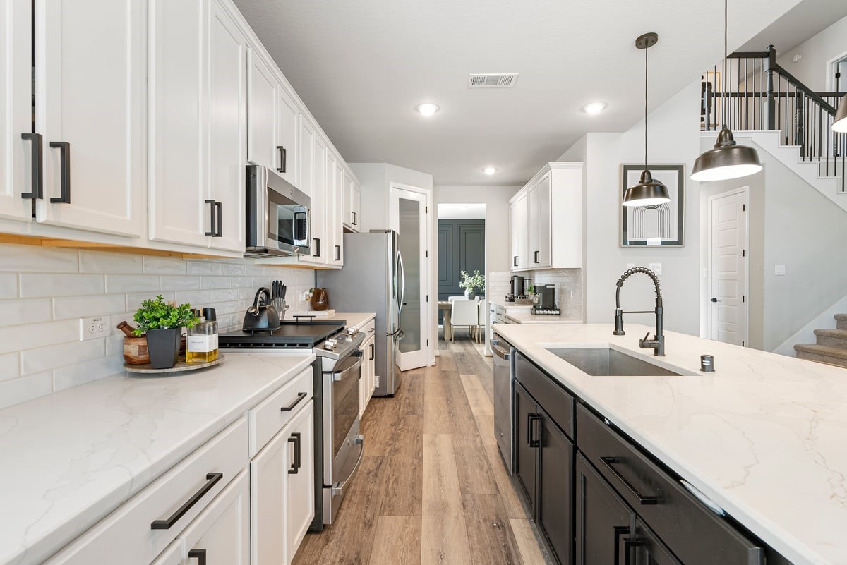 1702 Darwin Cedar Drive Rosharon, TX 77583 - Photo 18 of 44 Prep gourmet meals on the expansive quartz counters with subway tile backsplash!