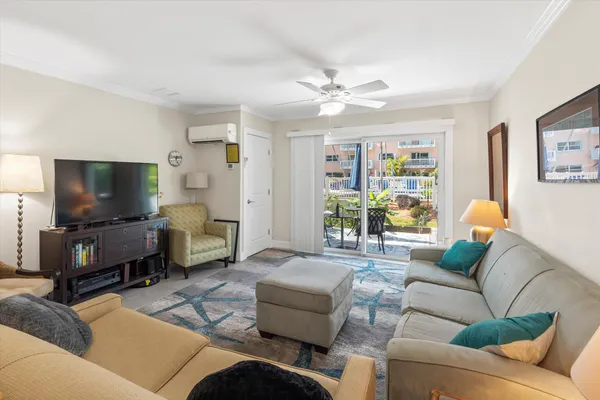 a living room with furniture and a flat screen tv