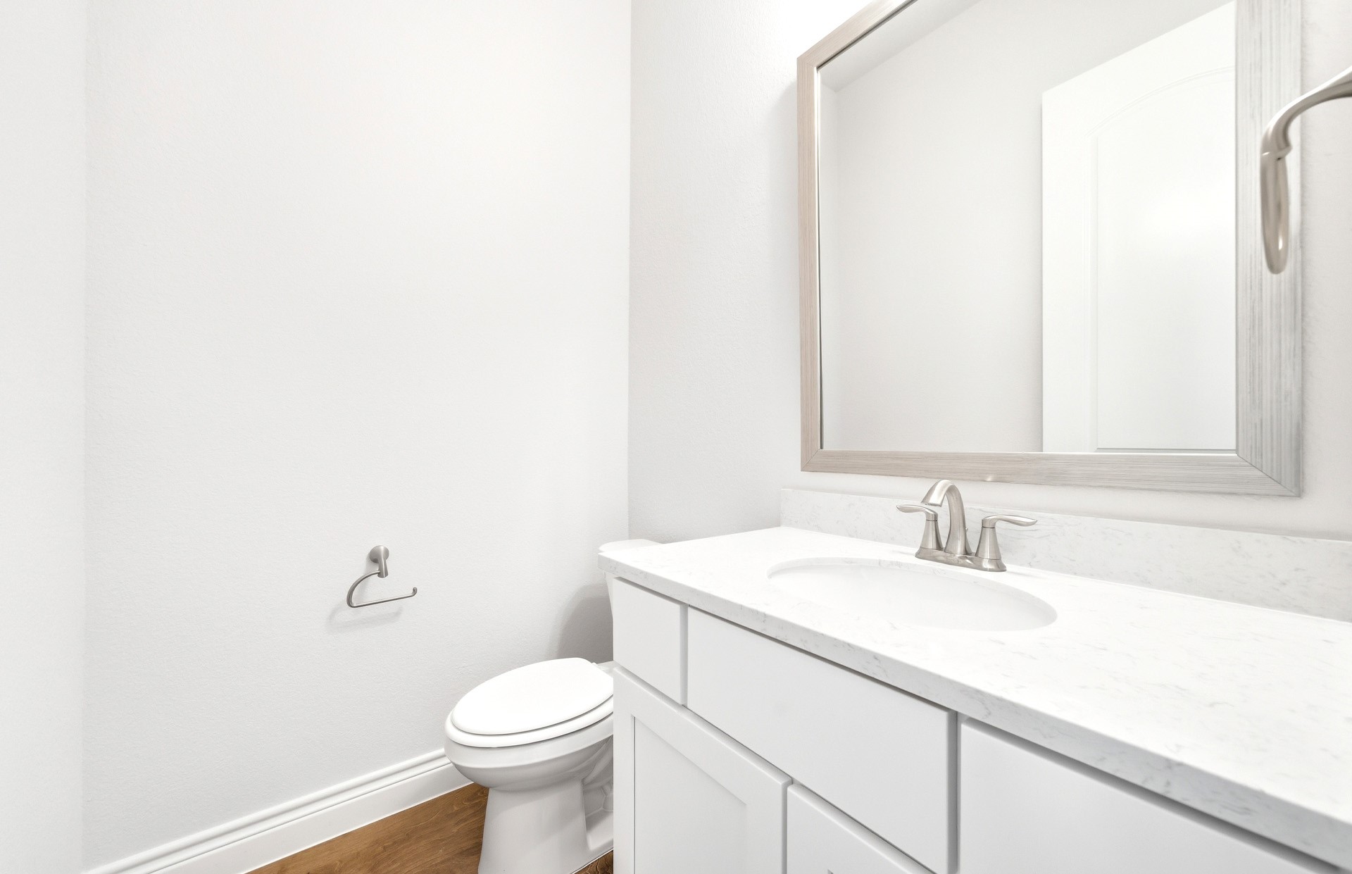 38642 Night Brood Court Magnolia, TX 77354 - Photo 25 of 32 a bathroom with a sink a toilet and a mirror