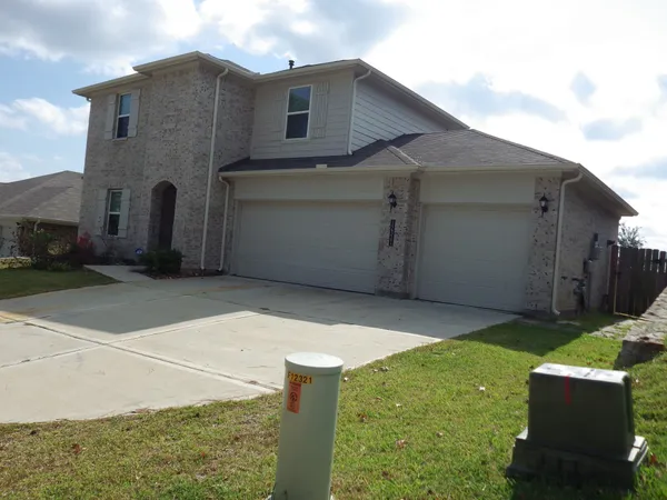 a backyard of a house with garage