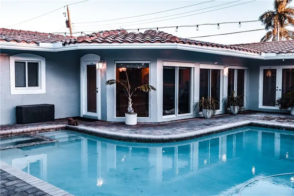 a view of a house with swimming pool
