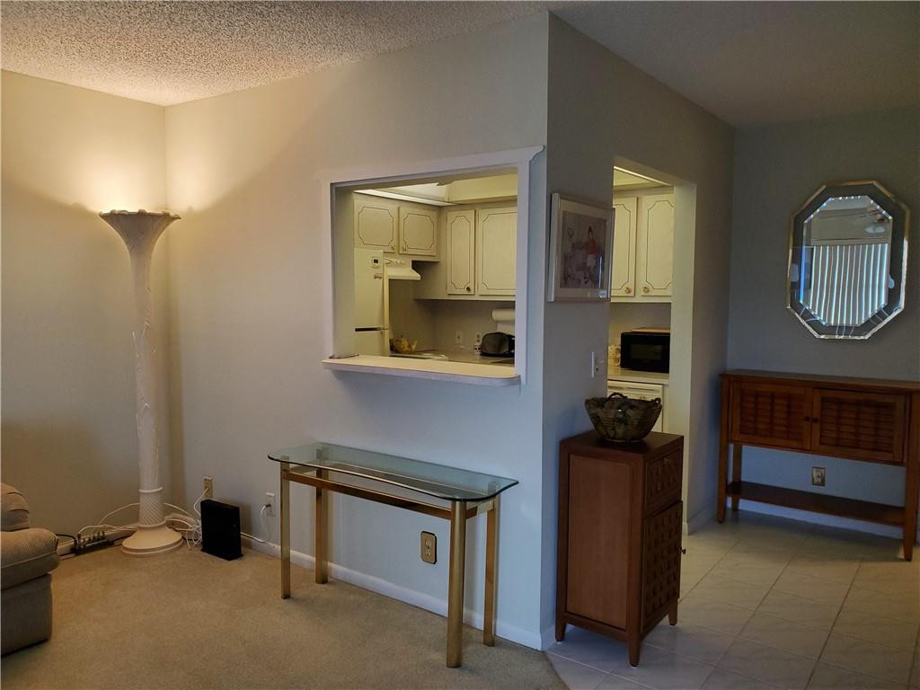 41 Suffolk A, Unit 41 Boca Raton, FL 33434 - Photo 2 of 12 a room with storage and utility