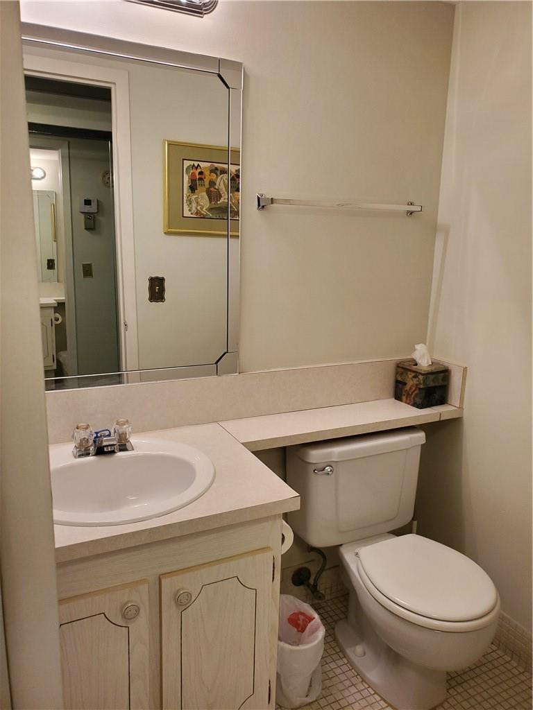 41 Suffolk A, Unit 41 Boca Raton, FL 33434 - Photo 8 of 12 a bathroom with a toilet sink and mirror