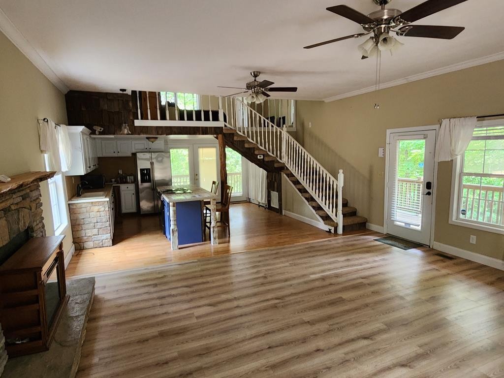1939 Hodgetown Road Rutledge, TN 37861 - Photo 52 of 63 a view of a livingroom with furniture hardwood floor and a ceiling fan