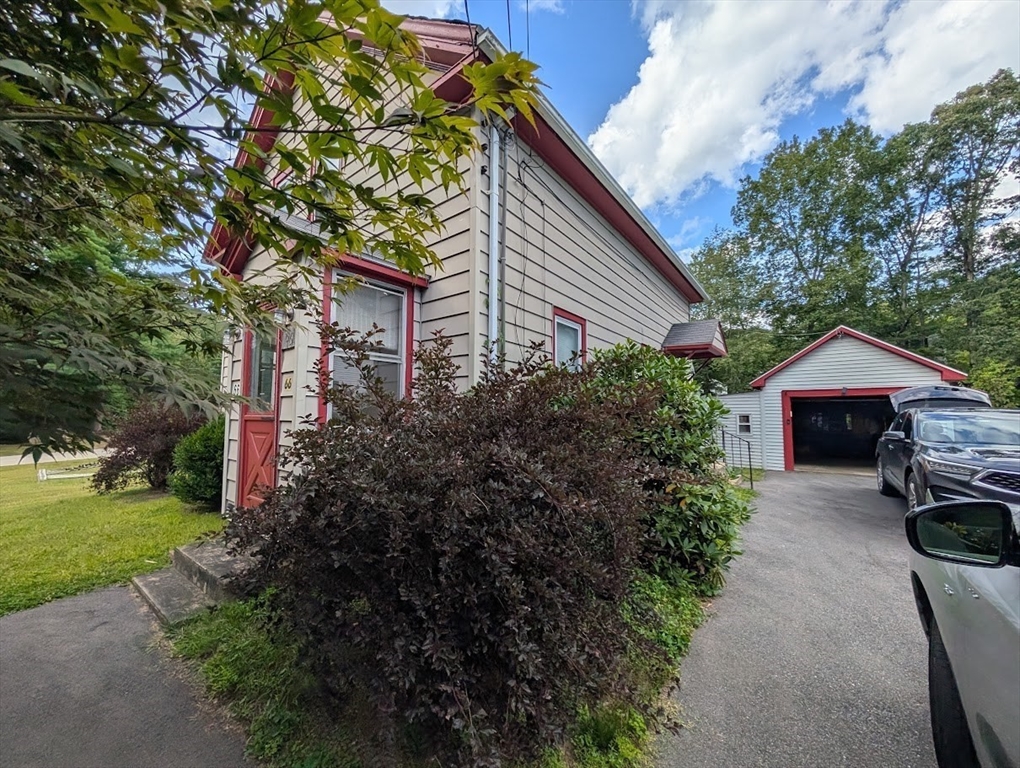 66 Brookfield Road Charlton, MA 01507 - Photo 29 of 35 a front view of a house with garden