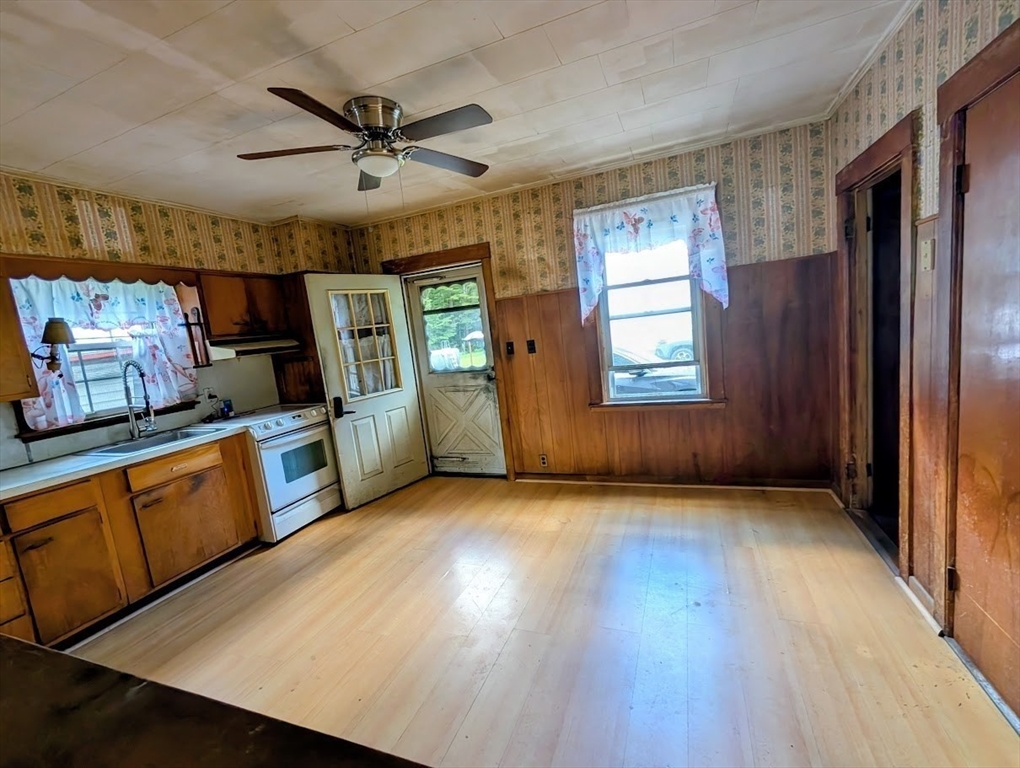 66 Brookfield Road Charlton, MA 01507 - Photo 5 of 35 a view of a kitchen with sink cabinets and wooden floor