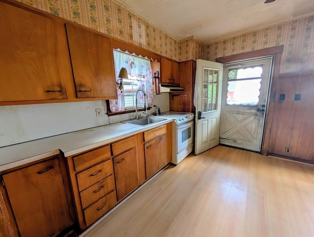 66 Brookfield Road Charlton, MA 01507 - Photo 7 of 35 a kitchen with stainless steel appliances granite countertop a sink a stove and a refrigerator