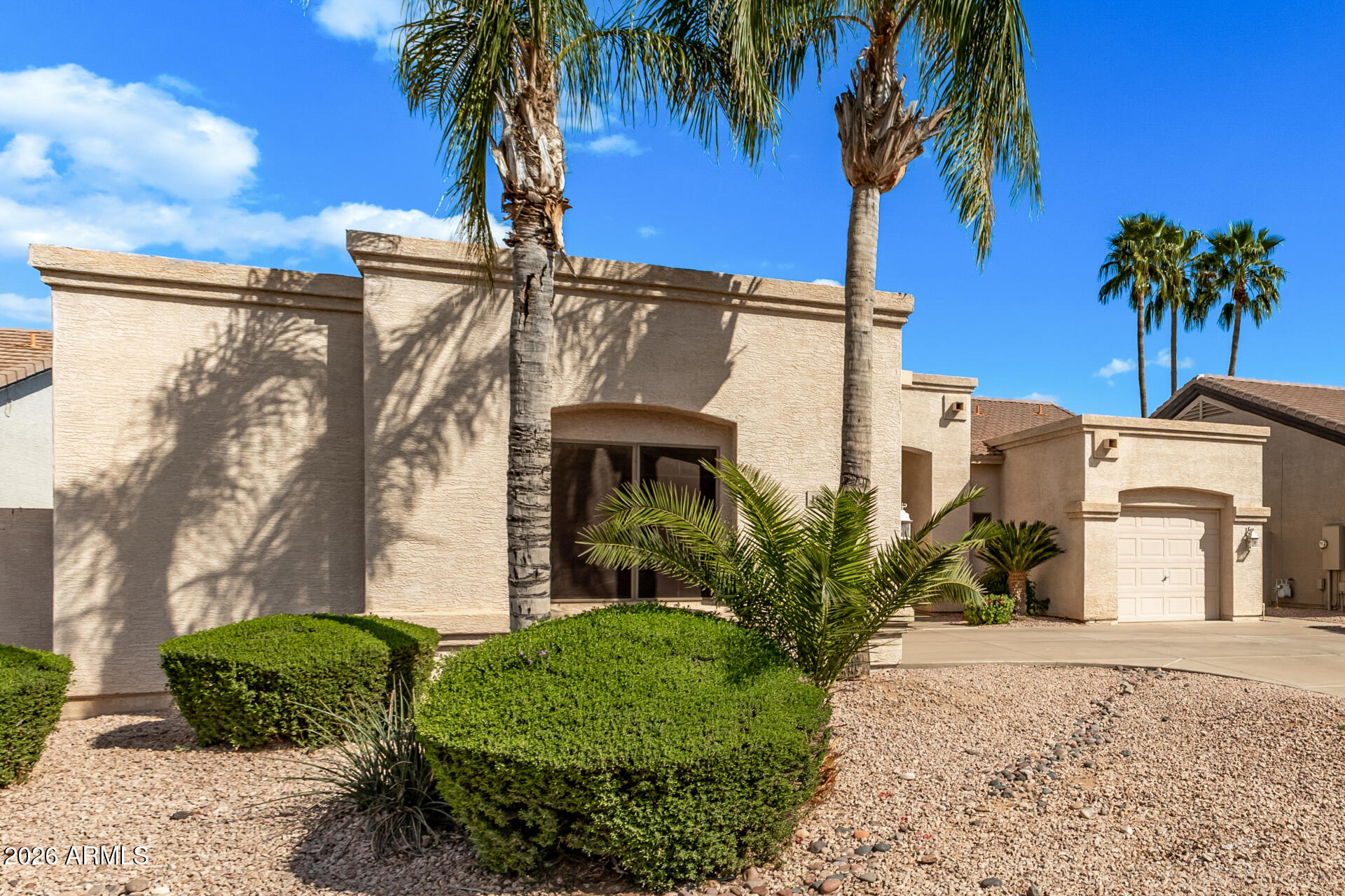 1865 South Morrison Lane Gilbert, AZ 85295 - Photo 2 of 30 a front view of a house with a yard and mountain view