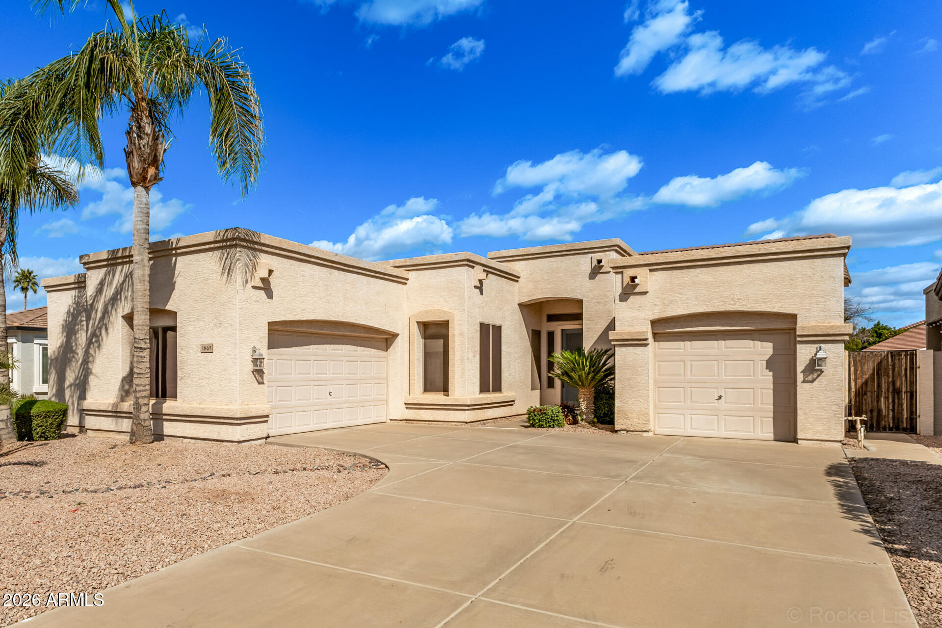 1865 South Morrison Lane Gilbert, AZ 85295 - Photo 3 of 30 a view of a parking space with palm trees