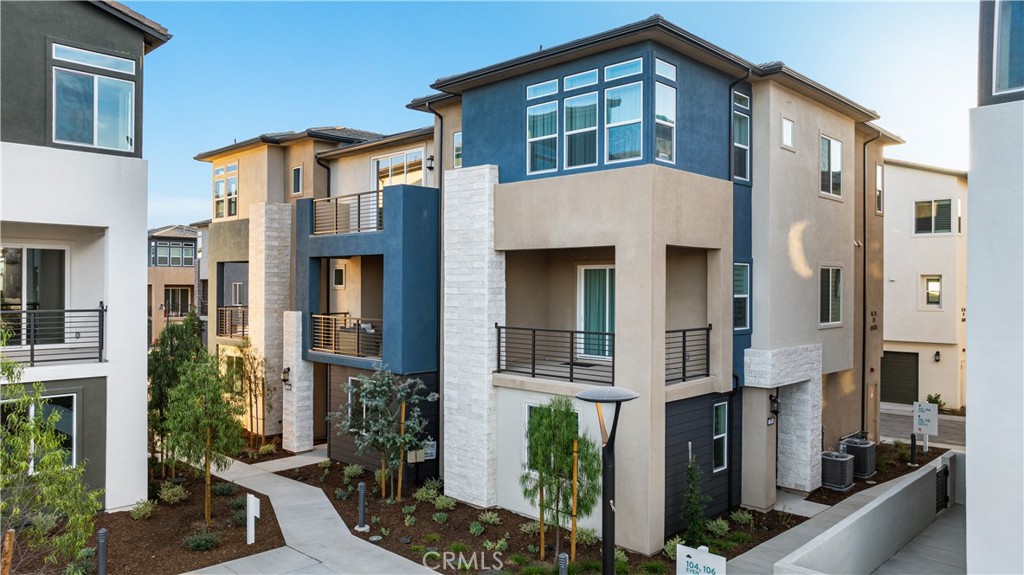 118 Abacus Irvine, CA 92618 - Photo 53 of 66 a front view of a house with a yard