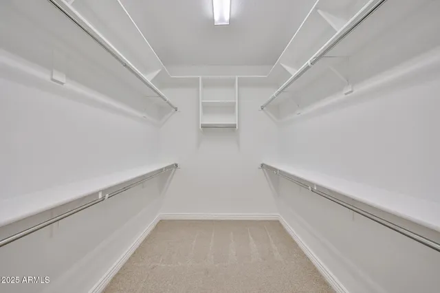 a view of an empty walk in closet