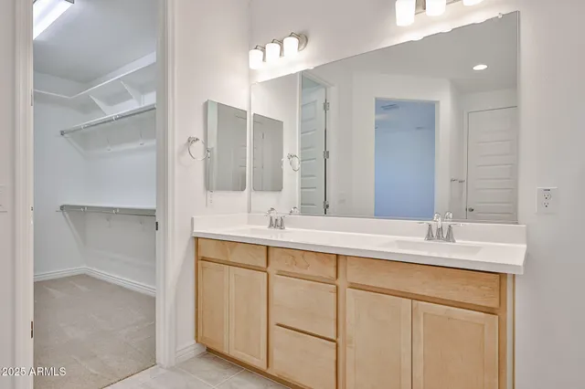 a bathroom with a double vanity sink mirror and double