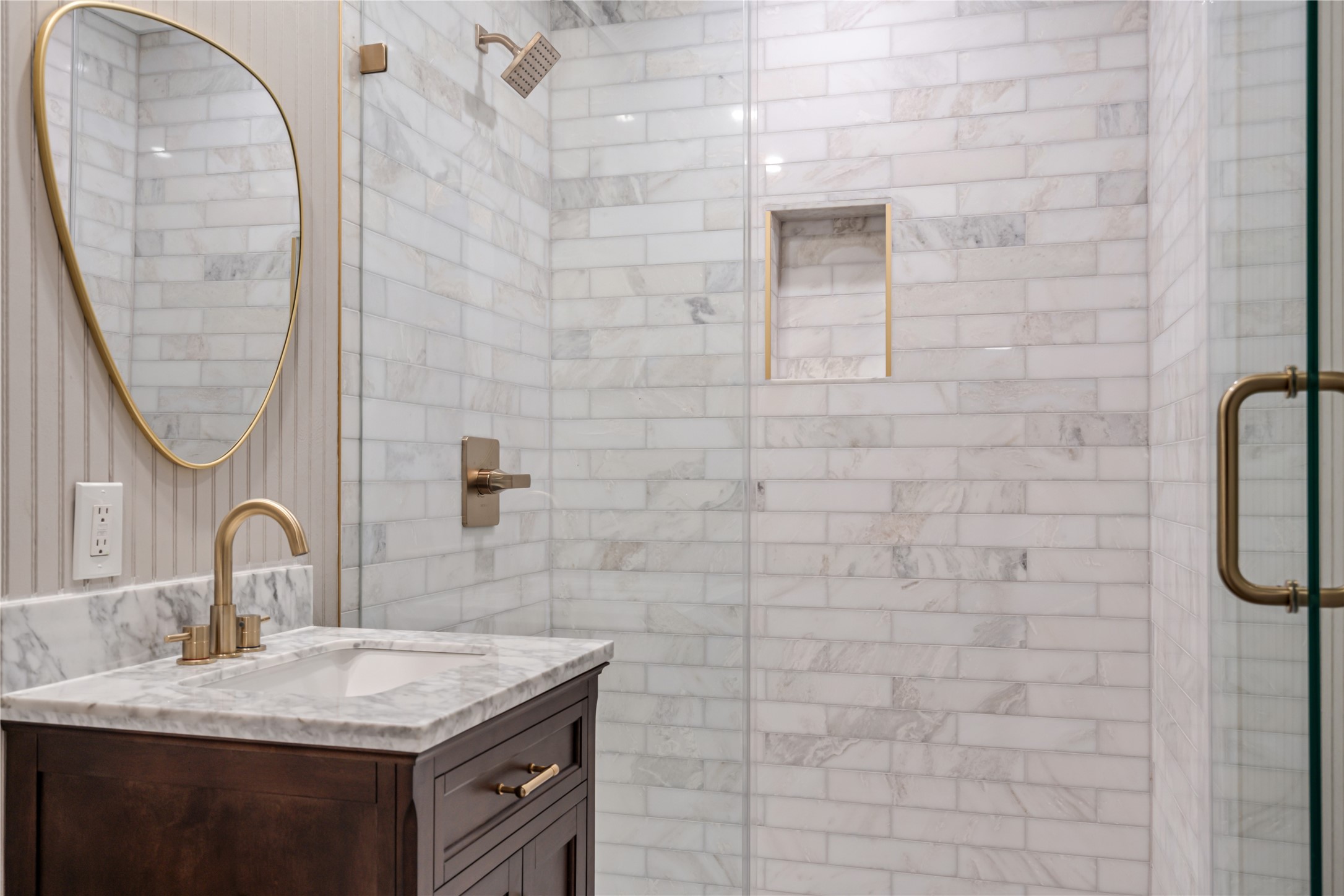 327 Middleton Street Bacliff, TX 77518 - Photo 12 of 23 a bathroom with a sink a mirror and a shower
