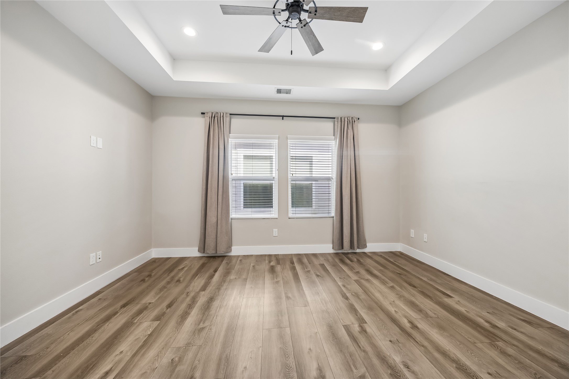 1209 West Tidwell Road Houston, TX 77091 - Photo 18 of 25 Oversized primary suite, tray ceiling and curtains
