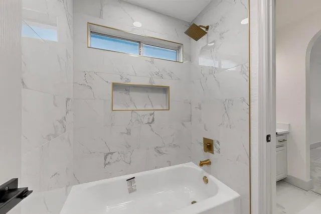 a bathroom with a sink and a shower