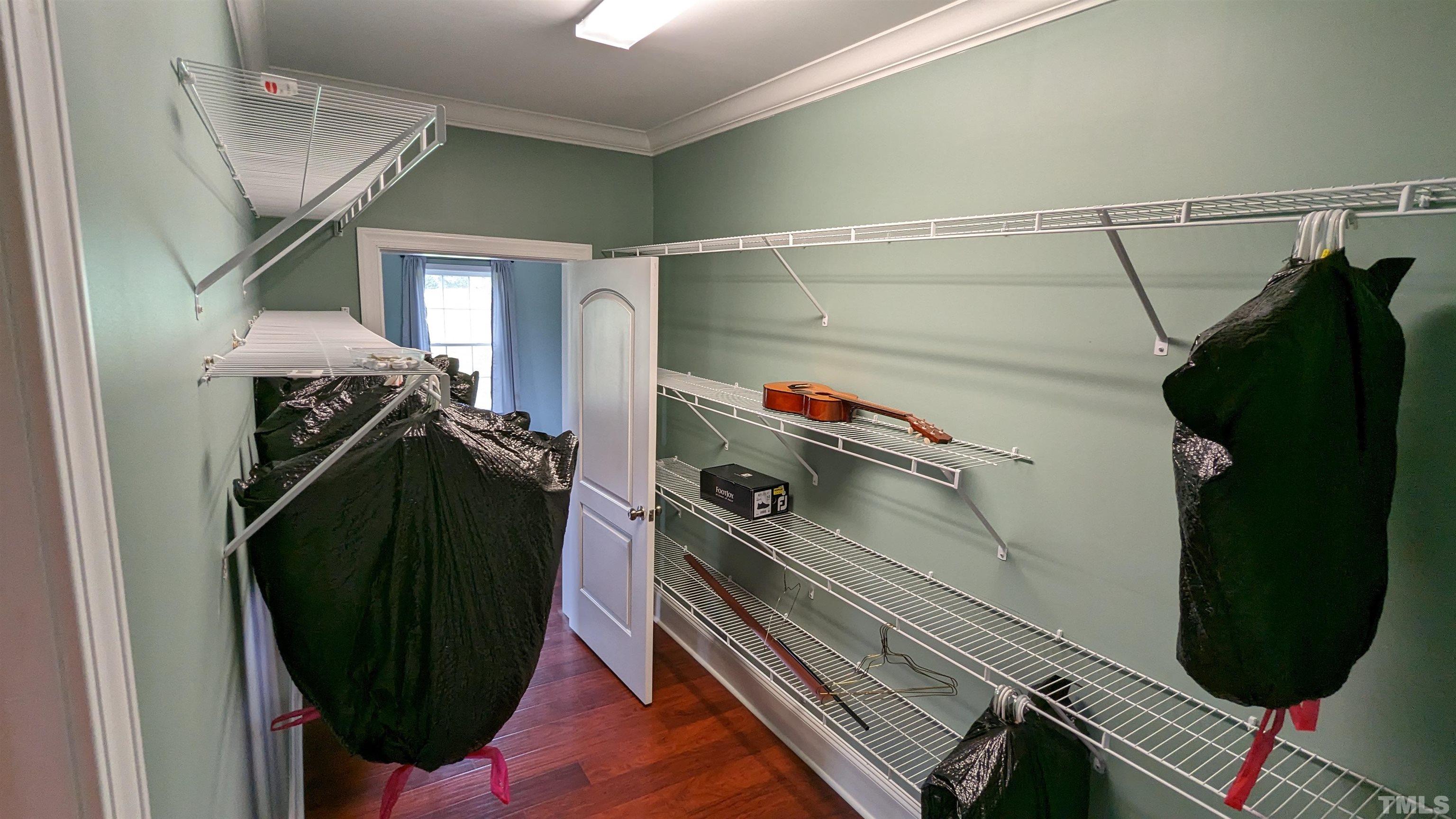 304 Bernard Purvis Road Bennett, NC 27208 - Photo 11 of 33 a view of walk in closet with clothes and shoes