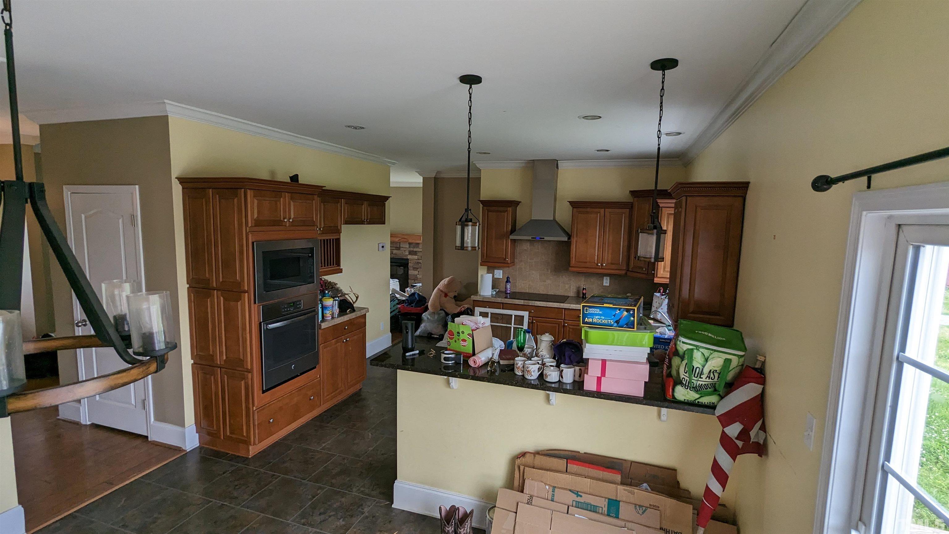 304 Bernard Purvis Road Bennett, NC 27208 - Photo 17 of 33 a kitchen with stainless steel appliances granite countertop a refrigerator and a sink