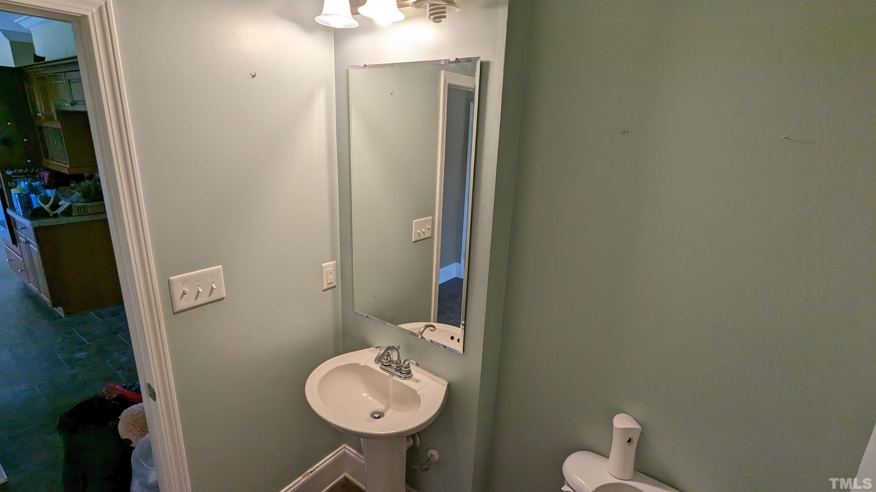 304 Bernard Purvis Road Bennett, NC 27208 - Photo 23 of 33 a bathroom with a sink and toilet