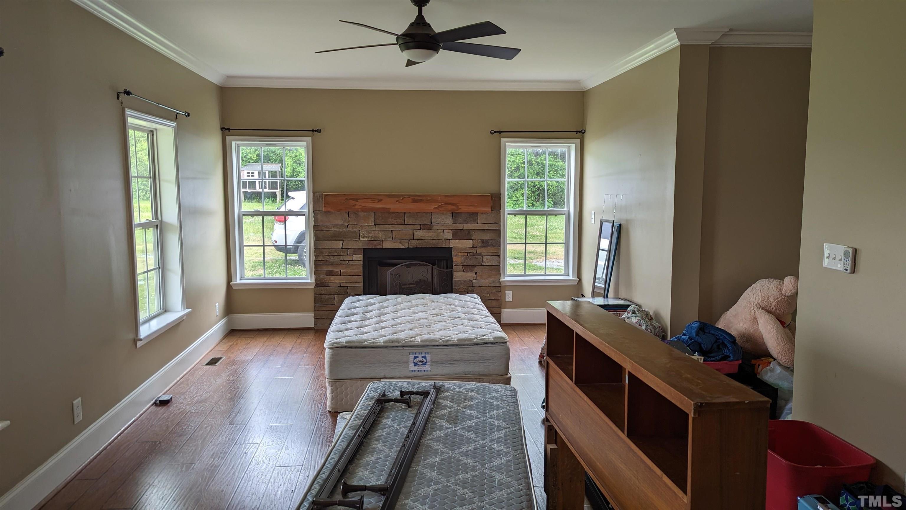 304 Bernard Purvis Road Bennett, NC 27208 - Photo 4 of 33 a living room with furniture and a fireplace