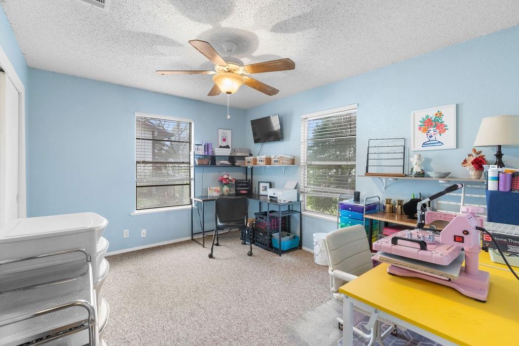 1320 Elm Street Bonham, TX 75418 - Photo 22 of 40 a view of a workspace with furniture and a window