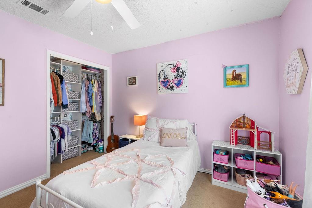 1320 Elm Street Bonham, TX 75418 - Photo 25 of 40 a bedroom with a bed and a closet