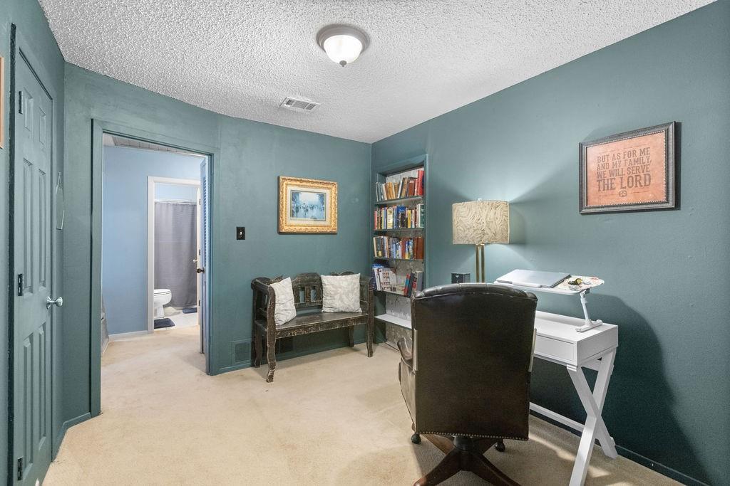 1320 Elm Street Bonham, TX 75418 - Photo 28 of 40 a workspace with furniture and a window