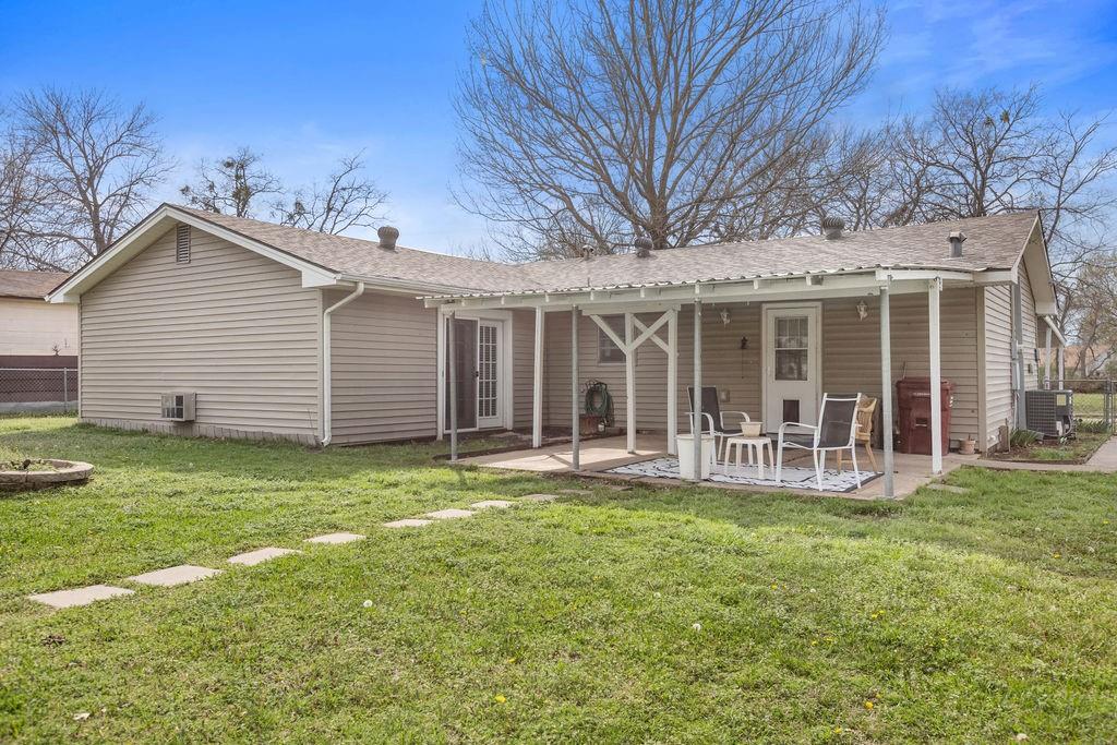 1320 Elm Street Bonham, TX 75418 - Photo 30 of 40 a front view of a house with a yard and porch