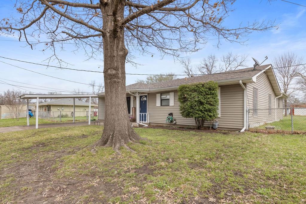 1320 Elm Street Bonham, TX 75418 - Photo 3 of 40 a view of a house with backyard and a tree
