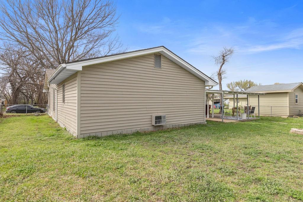1320 Elm Street Bonham, TX 75418 - Photo 33 of 40 a view of a house with a yard