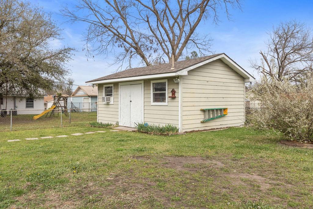 1320 Elm Street Bonham, TX 75418 - Photo 35 of 40 a view of a house with a yard