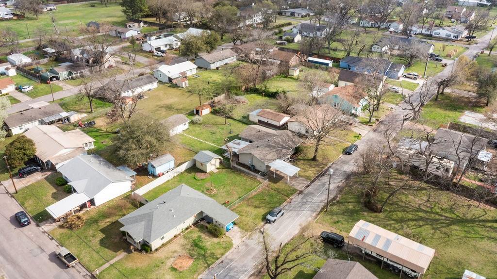 1320 Elm Street Bonham, TX 75418 - Photo 37 of 40 an aerial view of residential houses with outdoor space