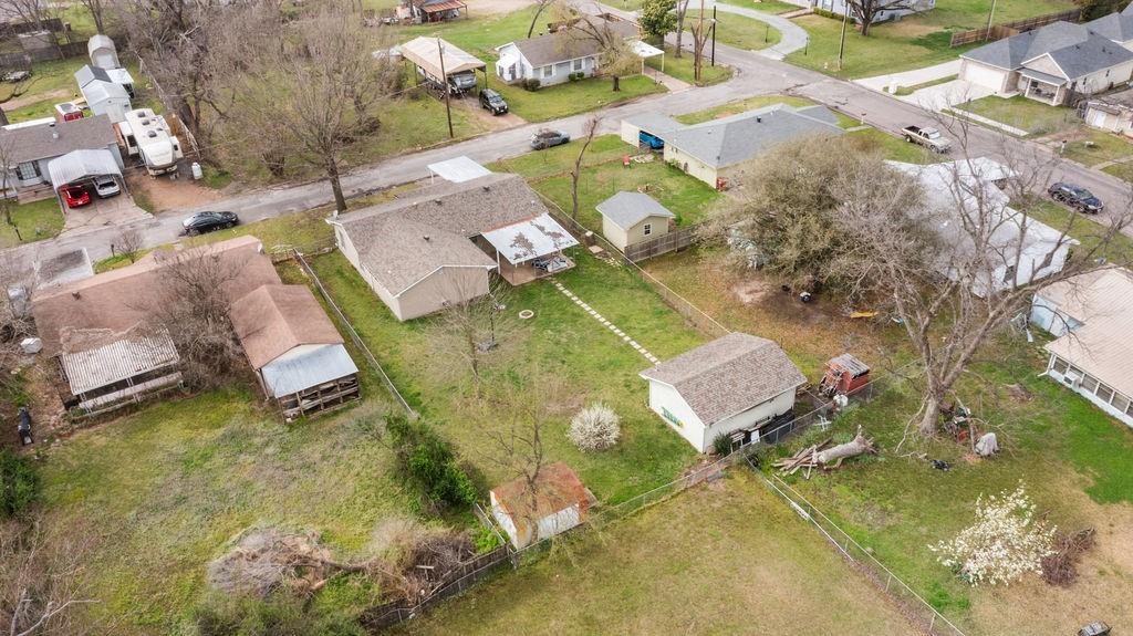 1320 Elm Street Bonham, TX 75418 - Photo 39 of 40 an aerial view of a house with a yard and lake view