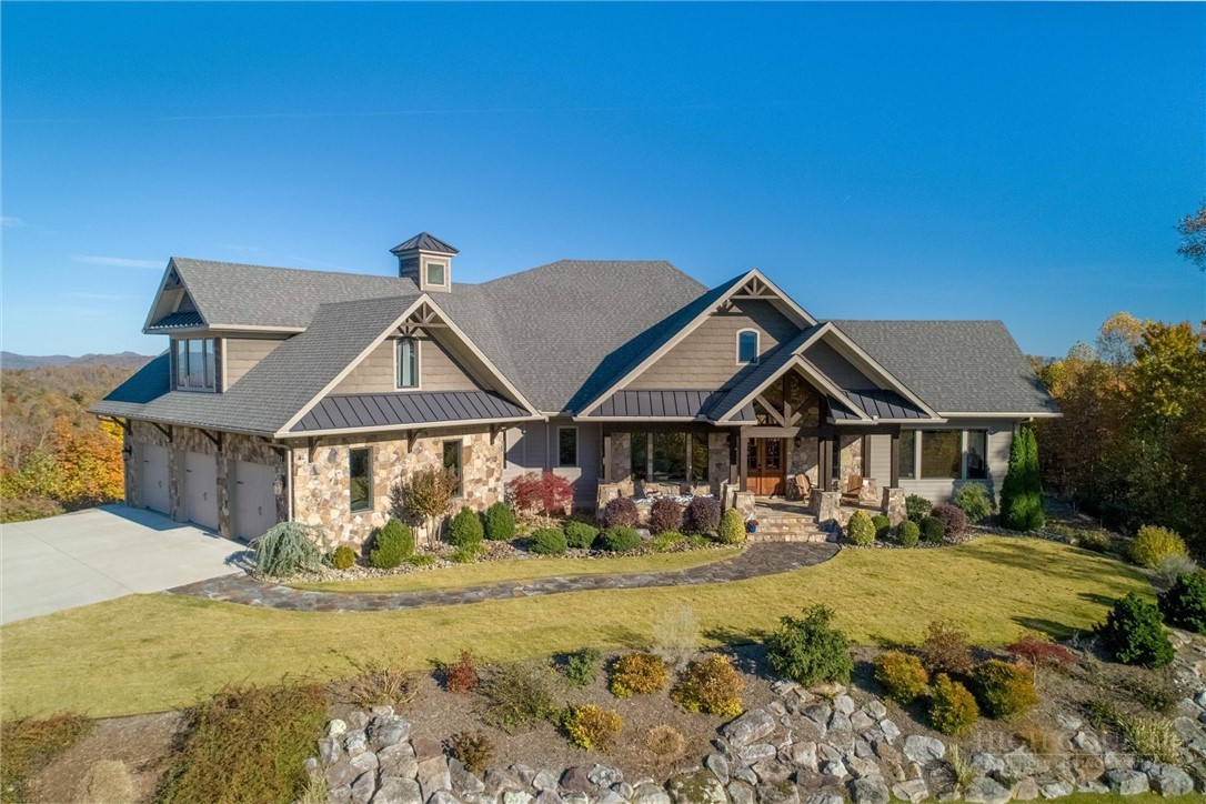 1638 Johns Ridge Parkway Lenoir, NC 28645 - Photo 1 of 50 a front view of a house with garden