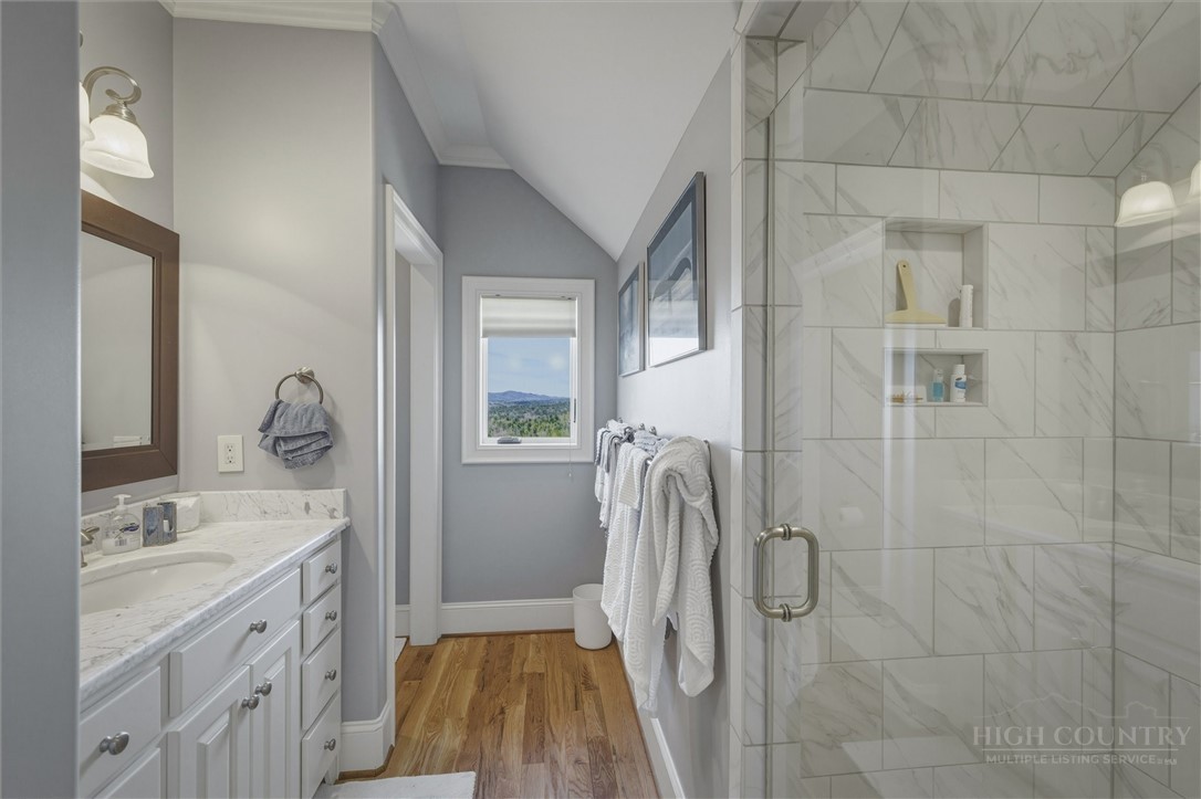 1638 Johns Ridge Parkway Lenoir, NC 28645 - Photo 26 of 50 a spacious bathroom with a granite countertop sink and a mirror