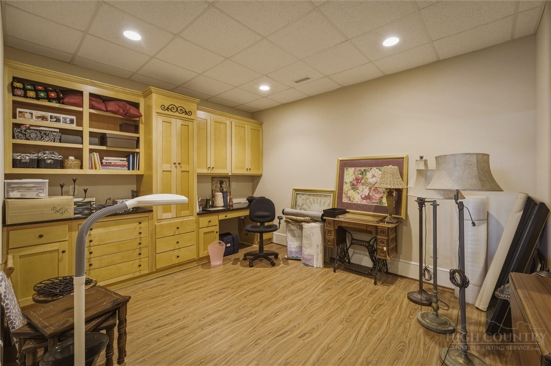 1638 Johns Ridge Parkway Lenoir, NC 28645 - Photo 29 of 50 a workspace with furniture window and wooden floor